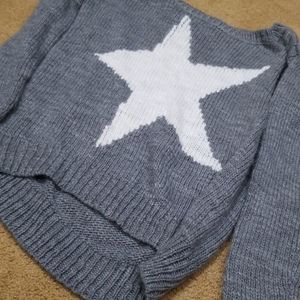A grey aeropostale sweater with a white star